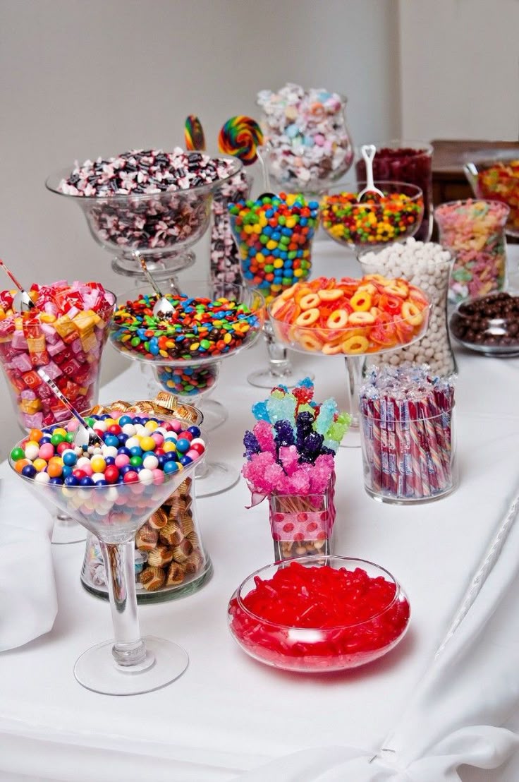 Elegant selection of sweets in branded packaging arranged on a modern table with business-themed decorations. The scene feels professional and inviting.